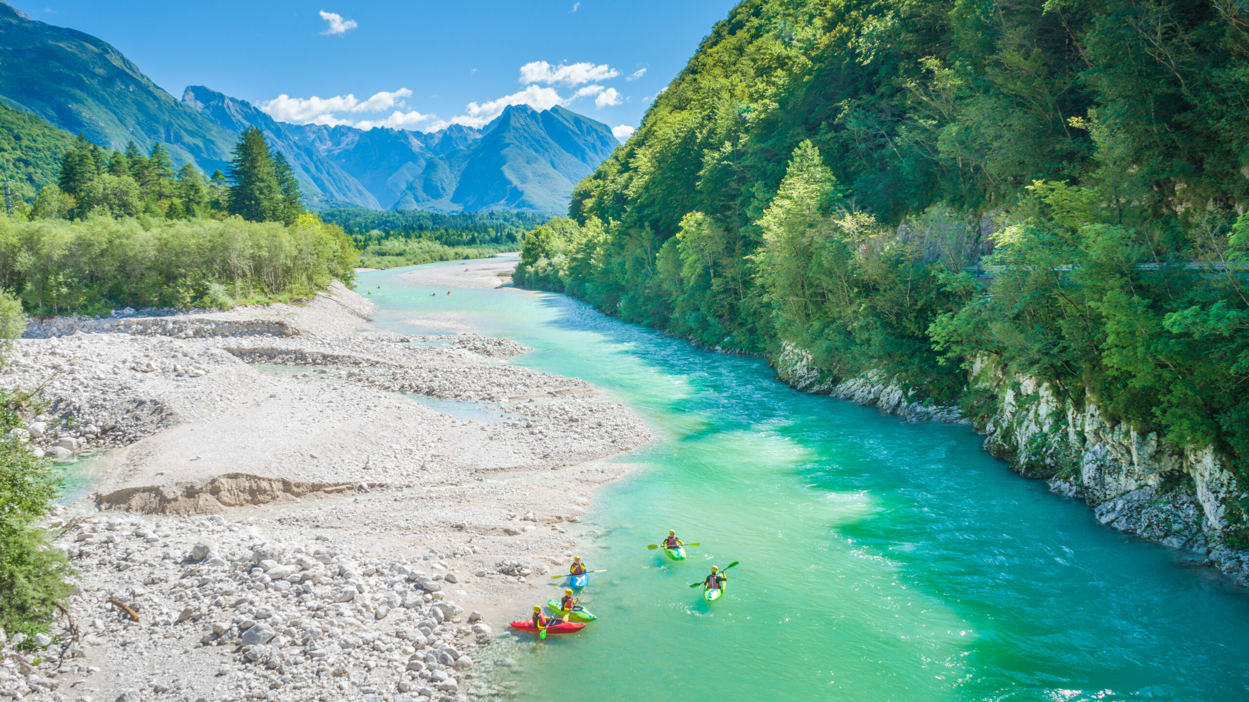Watersport in river with mountains in the background